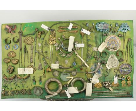 A rare collection Amoy &amp; Hakka 19th Century Jewellery, mounted on a green silk covered board, comprising various ear pend