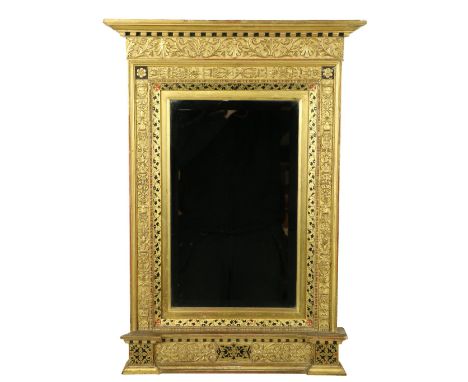 A good Architectural Wall Mirror, in the Pre-Raphaelite style with Greek key cornice, the frame in low relief with scrolling 