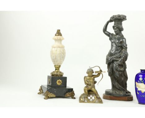 A 19th Century lead Figure, of a classical Maiden with basket of flowers aloft, 13" (33cms), a small brass cherub Candlestick