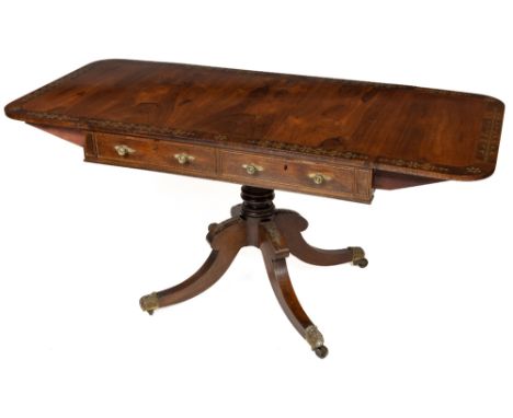 A fine quality Regency period rosewood drop leaf Sofa Table, the figured top with demi-lune flaps, and an ornate inlaid brass