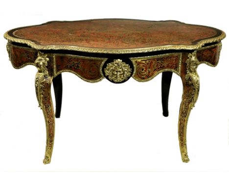 A fine 19th Century French Boulle Centre Table, of serpentine form by Tahin of Paris (stamped on lock) the top with a tongue 