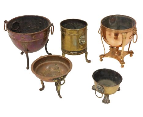 An attractive copper Jardiniere, with lion mask and ring handles, on four tapering reeded supports with paw terminals on a qu
