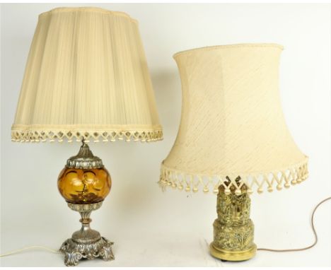 An embossed brass Table Lamp, the two stage body with classical figures in relief supporting an ivory shade, 27" (69cms); tog