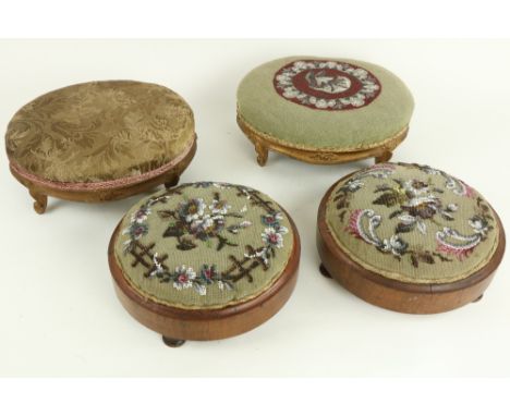 A pair of small French serpentine shaped upholstered Footstools, each on four cabriole legs, 13" (33cms), and a pair of circu