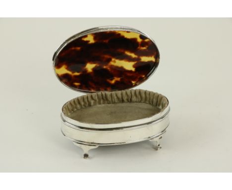 An oval Birmingham silver and tortoiseshell&nbsp;Dressing Table Jewellery Casket, on scroll legs, 5 1/4" (13cms). (1) 