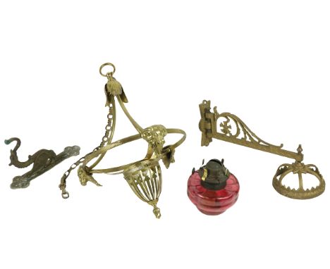 A brass Student's Lamp, with milk glass shade, 18" (46cms), together with an old cast iron Oil Lamp Wall Bracket with associa