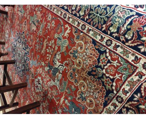 An attractive antique style Middle Eastern Carpet, the large central panel depicting figures in typical attire and on horseba