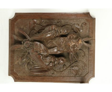 A carved oak Panel,&nbsp;depicting hanging dead game in high relief 15 1/2" x 12" (39cms x 31cms), a carved wooden Bracket wi