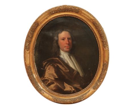 Late 17th Century English School&nbsp; 'Portrait of a Gentleman,' O.O.C., oval, half length depicting man in brown velvet coa