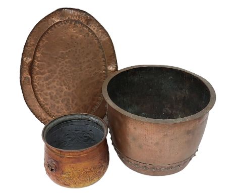 A very large copper Cauldron, with riveted bands, 16"h x 22"w (41cms x 56cms); together with a large oval copper Platter with