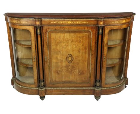 A good Victorian walnut and marquetry inlaid Credenza, with brass mounts, the centre inlaid panel door with a dark centre med