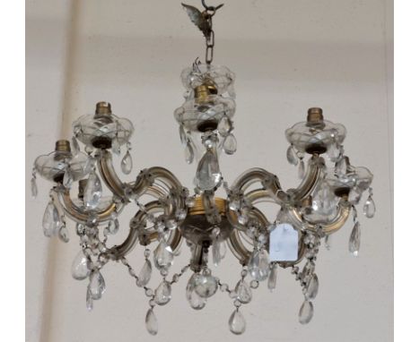 A 19th Century eight branch single tier Chandelier, with droplets and holders and shaped branches. (1)