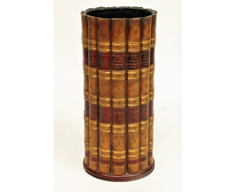 A cylindrical&nbsp;composition Stick Stand, modelled with faux leather book spines, 19 1/2' (50cms). (1) 