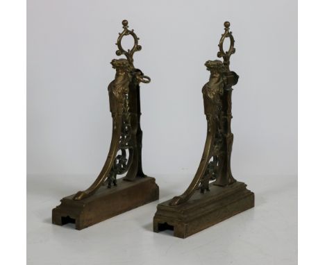 A Fireguard with a pair of 19th Century brass Andirons, decorated with bearded figures, pierced and scroll design. (1) 