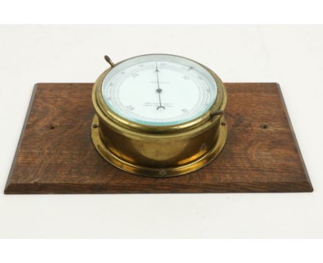 A circular bass compensated&nbsp;Ships Barometer, by John Lilley &amp; Son, Limited, London &amp; North Shields, mounted on a