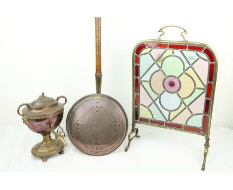 A brass cheval Firescreen, with coloured and leaded glass panel, together with a copper Bed Warmer with turned wooden handle,