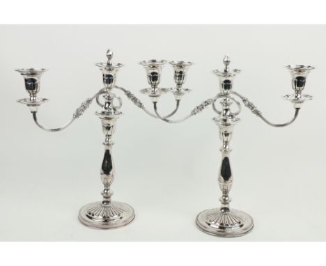 A good pair of Sheffield plated two branch - three light Candelabra, with scrolling reeded arms, 15 1/2" (39cms). (1) 