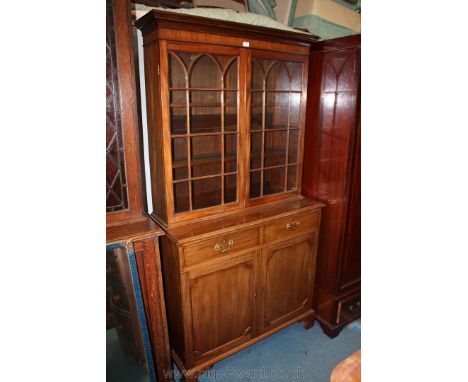 A superb quality reproduction Georgian style Mahogany glazed Bookcase on Cupboard having moulded cornice over the upper pair 