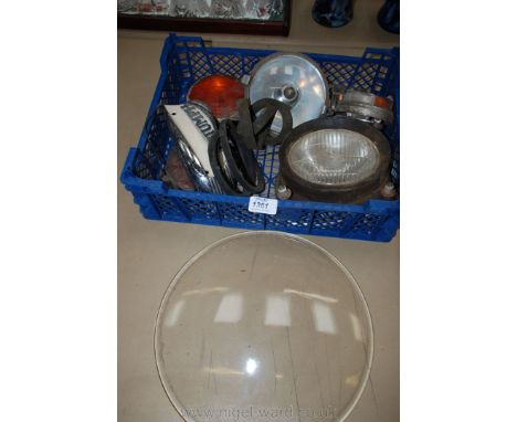A quantity of old vehicle indicator Lights and prisms, a spotlight, a large lamp glass, 12'' diameter approx., a Triumph moto