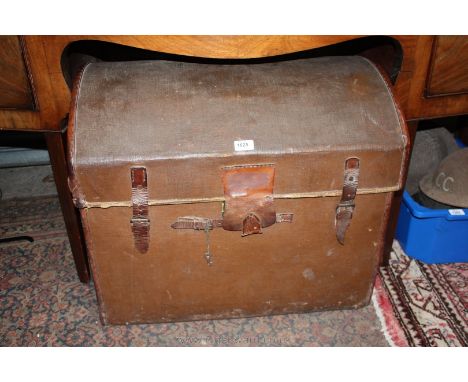 A late 19th/early 20th c. Dome topped Travel Trunk, canvas covered with leather corners and fastening straps.