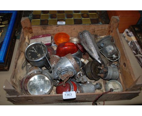 A quantity of old Bicycle and other Lamp parts, a volt meter, a fuel filter bowl housing, a car dashboard clock (clockwork), 