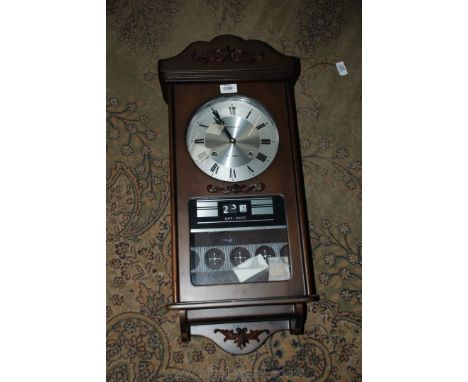 A President contemporary darkwood Wall Clock having two train, 31 day movement with day date indicator.