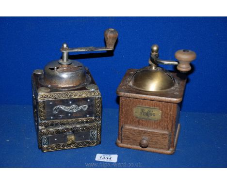 An ornate Coffee Grinder and a brass Coffee Grinder.