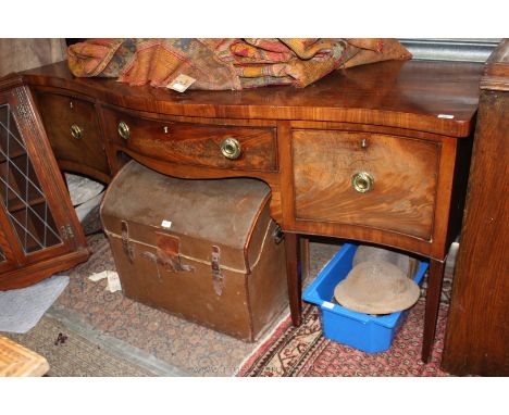 An early 19th c. Mahogany serpentine Sideboard of large proportion, having thick, well figured top over the central large bai