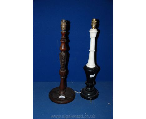 A Mahogany turned and carved Table Lamp and a black and white wooden Table Lamp.