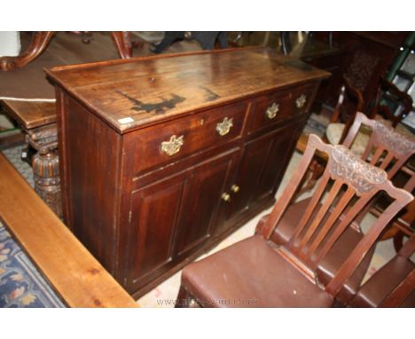 A good 19th c. Oak Dresser Base having two plank top with rear lip, having two side by side frieze drawers with moulded front