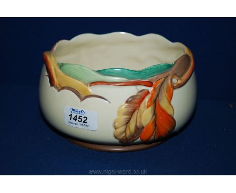 A Clarice Cliff Bowl with leaf decorated rim.