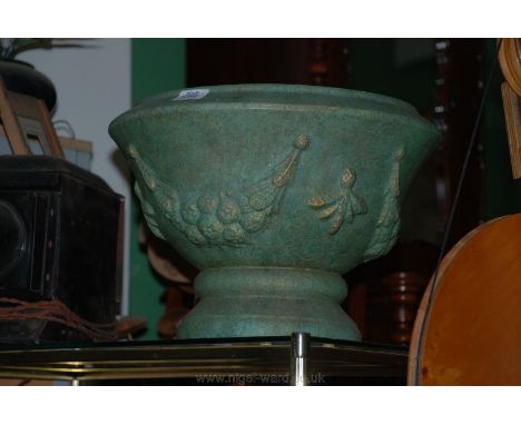 A terracotta verdigris decorated Planter