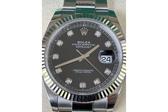 A mint condition Rolex with a full set.  Outer Box, Inner Box, Papers, Green hang tag, White hang
