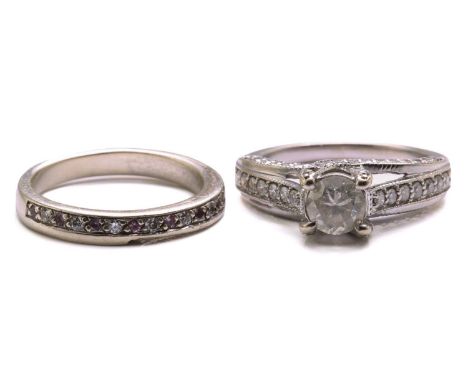 A diamond trellis engagement ring and a fitted enhancer guard; The engagement ring forms from one centre brilliant-cut diamon