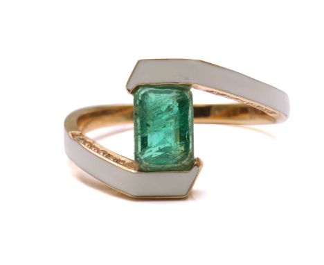 An emerald and enamel bypass ring, consisting of an emerald-cut green emerald of 6.4 x 4.7 mm, in a bypass setting with white