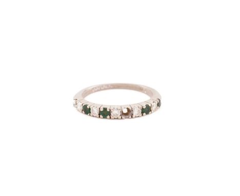 An emerald and diamond half eternity ring in 18ct white gold, comprises five round brilliant-cut diamonds alternating with ro
