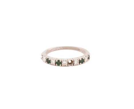 An emerald and diamond half eternity ring in 18ct white gold, comprises five round brilliant-cut diamonds alternating with ro