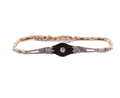 An onyx and diamond bracelet, comprising a grooved baluster-shaped panel, with an old-European cut diamond in collet setting 