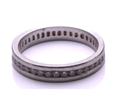 A full hoop diamond eternity ring, the round brilliant cut diamonds channel mounted within a platinum band. Total diamond wei