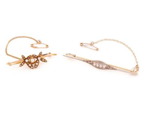 An Edwardian diamond bar brooch; the centre set with a horizontal row of four old brilliant cut diamonds within a rose diamon
