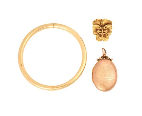 A 9ct gold locket, a pansy brooch pendant and a hinged bangle; the oval locket comprises an engine-turned cover and scrolled 