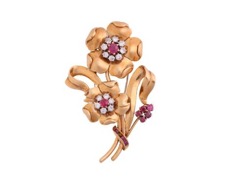 A brooch set with diamonds and rubies, in form of a sprig of flowers, with old-European cut diamond and ruby clusters as flow