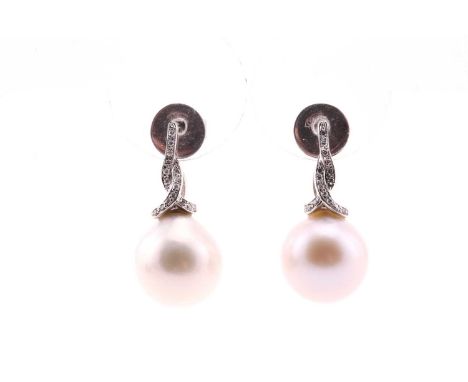 A pair of South-Sea pearl and diamond earrings, the slightly off-round pearls with diamond set scrolling, 14 carat white gold