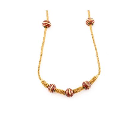  A yellow metal and enamel necklace; the beaded foxtail chain strung with five enamelled roundels in red and green, to a shep