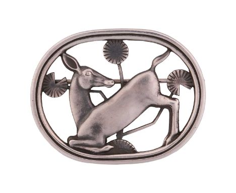 Georg Jensen - a brooch depicting kneeling fawn and flowers, fitted with hinged pin stem and roll-over safety catch, designed