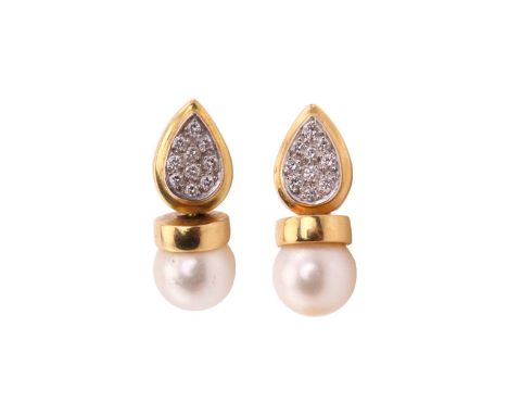 A pair of pearl and diamond earrings, each consisting of an 8.5 mm cream coloured pearl with pink overtone, set in a swivel y
