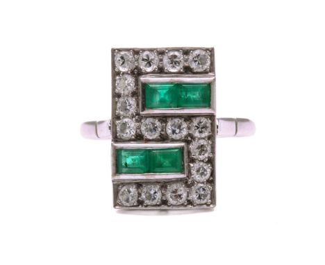 An Art Deco emerald and diamond panel ring, the slightly curved rectangular panel is pavé-set with old-European diamonds mean