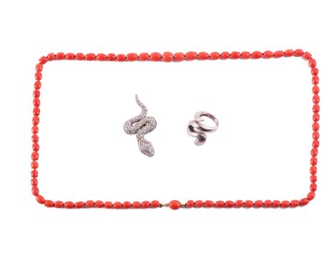 A precious coral necklace, a serpent ring and a pendant; the necklace comprises barrel-shaped red precious coral beads, hand 