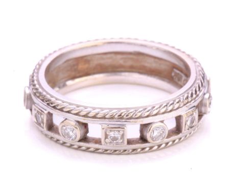 A diamond-set ring, containing circular-cut diamonds set in round and square-shaped collets, alternating on a D-section band 