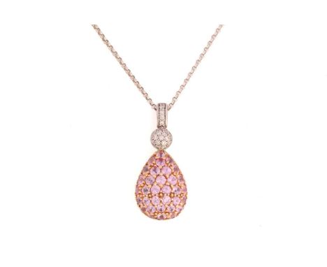 A pink sapphire and diamond pendant on chain, the egg-shaped pendant in 18ct white gold is fully encrusted with circular-cut 
